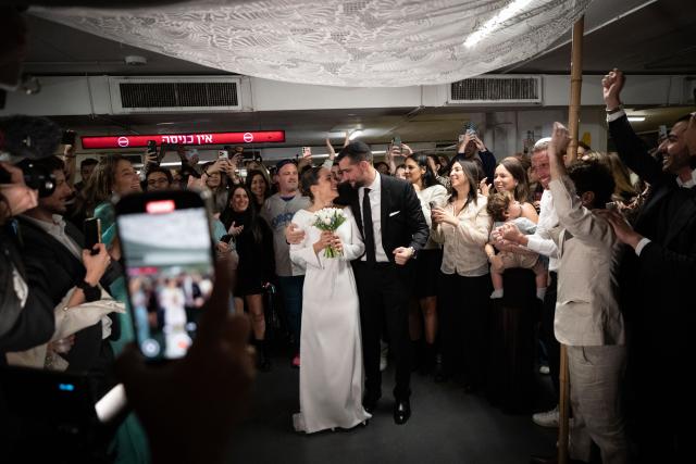 (260304) -- TEL AVIV, March 4, 2026 (Xinhua) -- People attend a wedding in an underground shelter in downtown Tel Aviv, Israel, March 3, 2026.
  Missiles and rockets fired from Iran and Lebanon struck central and northern Israel on Tuesday, Israeli authorities said, injuring one person and setting off air raid sirens in major cities.
   Warning sirens sounded in areas including Tel Aviv and Jerusalem around midday, sending millions of residents to bomb shelters. (Xinhua/Chen Junqing)
