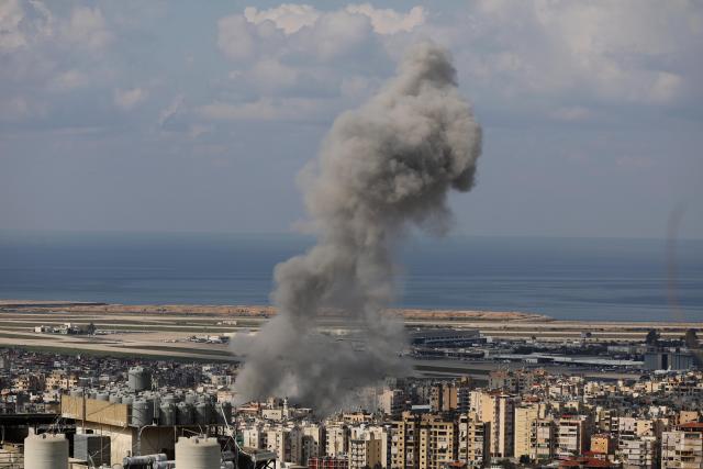 (260304) -- BEIRUT, March 4, 2026 (Xinhua) -- Smoke rises from buildings following Israeli bombing near the Rafic Hariri International Airport in Beirut, Lebanon, March 4, 2026. Tensions between Lebanon and Israel have escalated in recent days, with intensified airstrikes and exchanges of fire along the border, leading to mounting casualties, widespread displacement, and growing pressure on emergency response systems. (Photo by Bilal Jawich/Xinhua)