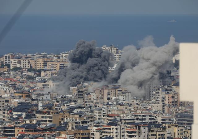 (260304) -- BEIRUT, March 4, 2026 (Xinhua) -- Smoke rises from buildings following Israeli bombing on Haret Hreik, south of Beirut, Lebanon, March 4, 2026. Tensions between Lebanon and Israel have escalated in recent days, with intensified airstrikes and exchanges of fire along the border, leading to mounting casualties, widespread displacement, and growing pressure on emergency response systems. (Photo by Bilal Jawich/Xinhua)