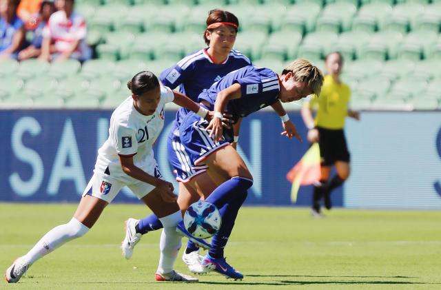 (260304) -- PERTH, March 4, 2026 (Xinhua) -- Chen Yu-chin (L) of Chinese Taipei vies for the ball during the Group C match of Women's Asian Cup between Chinese Taipei and Japan in Perth, Australia, March 4, 2026. (Photo by Zhou Dan/Xinhua)