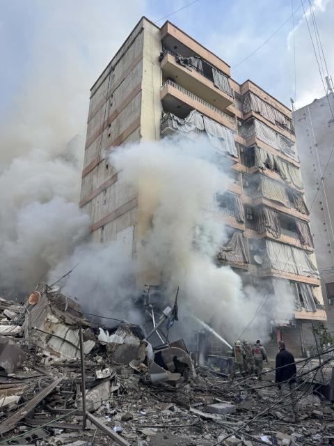 (260304) -- BEIRUT, March 4, 2026 (Xinhua) -- People carry out search and rescue operations after Israeli airstrikes in the southern suburbs of Beirut, Lebanon, March 4, 2026. At least 11 people were killed and 23 others injured in a series of Israeli airstrikes targeting several areas in Lebanon on Wednesday, according to Lebanese official sources.
   Lebanon's Public Health Emergency Operations Center, affiliated with the Ministry of Public Health, said that airstrikes on Aramoun and Saadiyat, south of Beirut, killed six people and wounded eight others, while rescue teams continued to search through the rubble at some of the targeted locations. (Photo by Bilal Jawich/Xinhua)