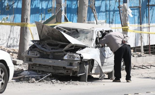 (260304) -- TEHRAN, March 4, 2026 (Xinhua) -- A man checks a damaged vehicle in Tehran, Iran, March 4, 2026. (Xinhua/Shadati)