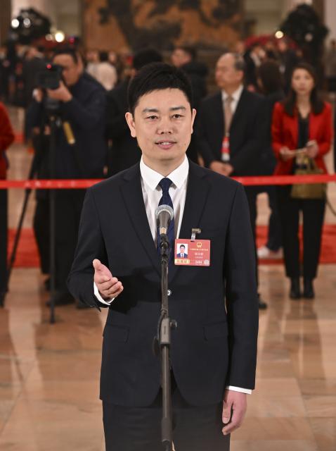 (260305) -- BEIJING, March 5, 2026 (Xinhua) -- Yang Yongxiu, a deputy to the 14th National People's Congress (NPC), attends a group interview ahead of the opening meeting of the fourth session of the 14th NPC at the Great Hall of the People in Beijing, capital of China, March 5, 2026. (Xinhua/Li Xin)