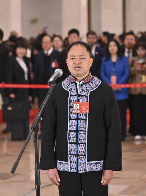 (260305) -- BEIJING, March 5, 2026 (Xinhua) -- Nong Jiagui, a deputy to the 14th National People's Congress (NPC), attends a group interview ahead of the opening meeting of the fourth session of the 14th NPC at the Great Hall of the People in Beijing, capital of China, March 5, 2026. (Xinhua/Li Xin)
