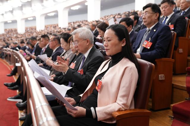 (260305) -- BEIJING, March 5, 2026 (Xinhua) -- Members of the National Committee of the Chinese People's Political Consultative Conference (CPPCC) sit in on the opening meeting of the fourth session of the 14th National People's Congress (NPC) as non-voting participants at the Great Hall of the People in Beijing, capital of China, March 5, 2026. (Xinhua/Li Xiao)