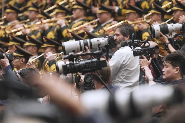 (260305) -- BEIJING, March 5, 2026 (Xinhua) -- Journalists work at the opening meeting of the fourth session of the 14th National People's Congress (NPC) at the Great Hall of the People in Beijing, capital of China, March 5, 2026. (Xinhua/Wang Xi)