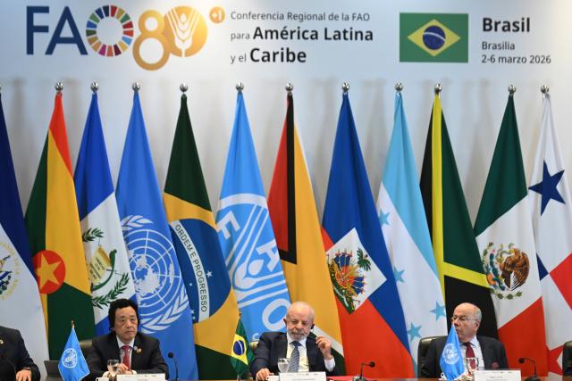 (260305) -- BRASILIA, March 5, 2026 (Xinhua) -- Brazilian President Luiz Inacio Lula da Silva (C), FAO Director-General Qu Dongyu (L), and Brazilian Foreign Minister Mauro Vieira attend the 39th Regional Conference of the Food and Agriculture Organization of the United Nations for Latin America and the Caribbean in Brasilia, Brazil, March 4, 2026. Lula on Wednesday criticized prioritizing military spending over food security, asserting that hunger eradication is an attainable goal hindered by a "lack of commitment."
   TO GO WITH "Brazil's Lula criticizes prioritizing military spending over food security" (Photo by Lucio Tavora/Xinhua)