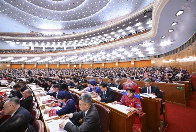 (260305) -- BEIJING, March 5, 2026 (Xinhua) -- The opening meeting of the fourth session of the 14th National People's Congress (NPC) is held at the Great Hall of the People in Beijing, capital of China, March 5, 2026. (Xinhua/Li Xiang)