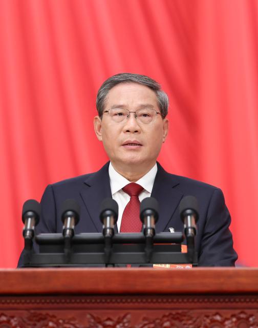 (260305) -- BEIJING, March 5, 2026 (Xinhua) -- Chinese Premier Li Qiang delivers a government work report at the opening meeting of the fourth session of the 14th National People's Congress (NPC) at the Great Hall of the People in Beijing, capital of China, March 5, 2026. (Xinhua/Huang Jingwen)