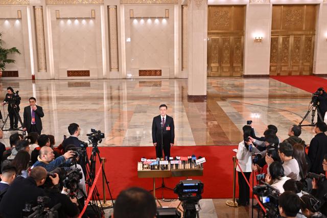 (260305) -- BEIJING, March 5, 2026 (Xinhua) -- Chinese Minister of Science and Technology Yin Hejun gives an interview after the opening meeting of the fourth session of the 14th National People's Congress (NPC) at the Great Hall of the People in Beijing, capital of China, March 5, 2026. (Xinhua/Li Xin)