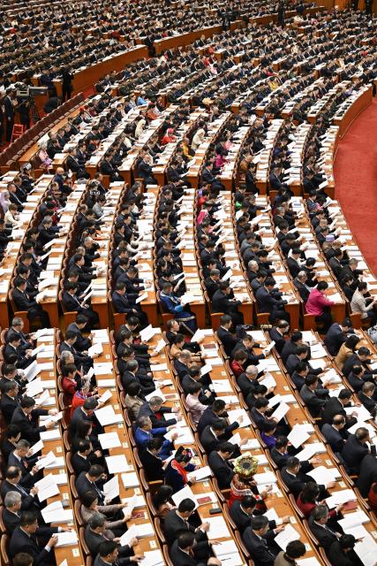 (260305) -- BEIJING, March 5, 2026 (Xinhua) -- The opening meeting of the fourth session of the 14th National People's Congress (NPC) is held at the Great Hall of the People in Beijing, capital of China, March 5, 2026. (Xinhua/Yin Bogu)