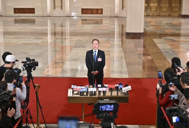 (260305) -- BEIJING, March 5, 2026 (Xinhua) -- Chinese Minister of Industry and Information Technology Li Lecheng gives an interview after the opening meeting of the fourth session of the 14th National People's Congress (NPC) at the Great Hall of the People in Beijing, capital of China, March 5, 2026. (Xinhua/Li Xin)