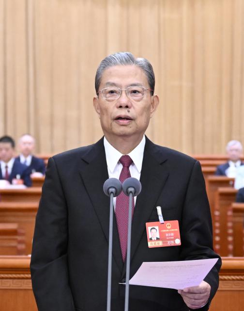 (260305) -- BEIJING, March 5, 2026 (Xinhua) -- Zhao Leji presides over the opening meeting of the fourth session of the 14th National People's Congress (NPC) at the Great Hall of the People in Beijing, capital of China, March 5, 2026. (Xinhua/Shen Hong)