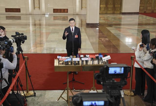 (260305) -- BEIJING, March 5, 2026 (Xinhua) -- Chinese Minister of Science and Technology Yin Hejun gives an interview after the opening meeting of the fourth session of the 14th National People's Congress (NPC) at the Great Hall of the People in Beijing, capital of China, March 5, 2026. (Xinhua/Wang Xi)