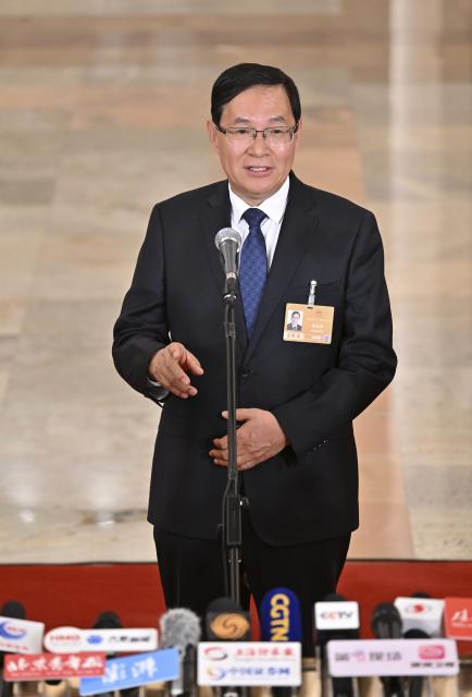 (260305) -- BEIJING, March 5, 2026 (Xinhua) -- Zhang Yuzhuo, head of the State-owned Assets Supervision and Administration Commission of the State Council, gives an interview after the opening meeting of the fourth session of the 14th National People's Congress (NPC) at the Great Hall of the People in Beijing, capital of China, March 5, 2026. (Xinhua/Li Xin)