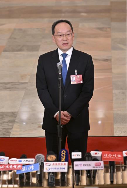 (260305) -- BEIJING, March 5, 2026 (Xinhua) -- Chinese Minister of Industry and Information Technology Li Lecheng gives an interview after the opening meeting of the fourth session of the 14th National People's Congress (NPC) at the Great Hall of the People in Beijing, capital of China, March 5, 2026. (Xinhua/Li Xin)