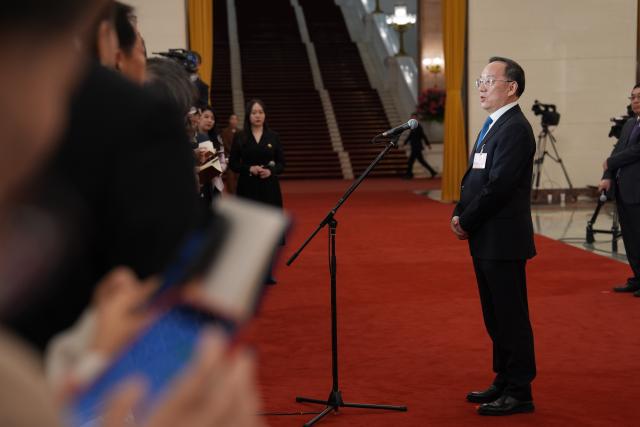 (260305) -- BEIJING, March 5, 2026 (Xinhua) -- Chinese Minister of Industry and Information Technology Li Lecheng gives an interview after the opening meeting of the fourth session of the 14th National People's Congress (NPC) at the Great Hall of the People in Beijing, capital of China, March 5, 2026. (Xinhua/Wang Xi)