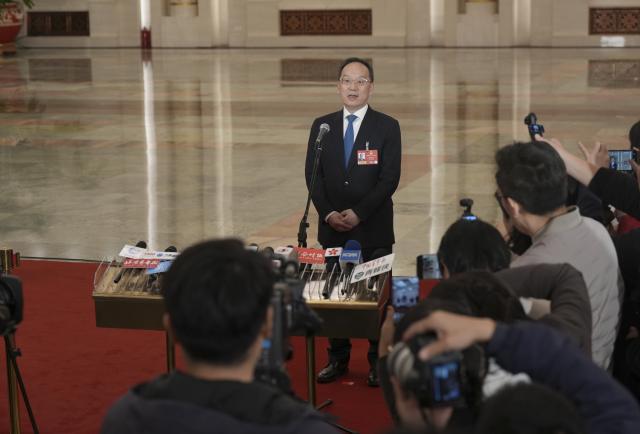 (260305) -- BEIJING, March 5, 2026 (Xinhua) -- Chinese Minister of Industry and Information Technology Li Lecheng gives an interview after the opening meeting of the fourth session of the 14th National People's Congress (NPC) at the Great Hall of the People in Beijing, capital of China, March 5, 2026. (Xinhua/Wang Xi)