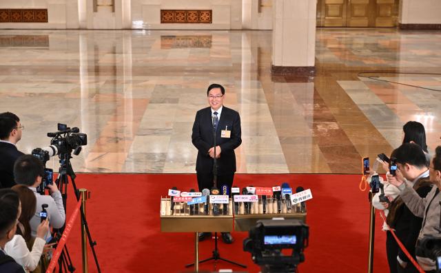 (260305) -- BEIJING, March 5, 2026 (Xinhua) -- Zhang Yuzhuo, head of the State-owned Assets Supervision and Administration Commission of the State Council, gives an interview after the opening meeting of the fourth session of the 14th National People's Congress (NPC) at the Great Hall of the People in Beijing, capital of China, March 5, 2026. (Xinhua/Li Xin)