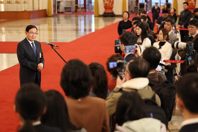 (260305) -- BEIJING, March 5, 2026 (Xinhua) -- Zhang Yuzhuo, head of the State-owned Assets Supervision and Administration Commission of the State Council, gives an interview after the opening meeting of the fourth session of the 14th National People's Congress (NPC) at the Great Hall of the People in Beijing, capital of China, March 5, 2026. (Xinhua/Jin Liwang)