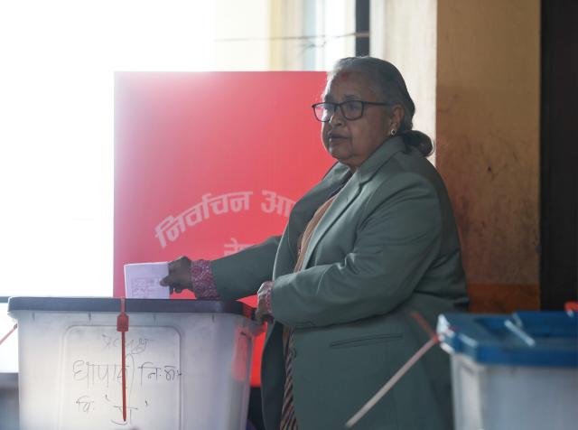 (260305) -- KATHMANDU, March 5, 2026 (Xinhua) -- Nepal's interim Prime Minister Sushila Karki casts her vote during the country's parliamentary election at a polling station in Kathmandu, Nepal, on March 5, 2026. Voting began across Nepal on Thursday morning to elect a new House of Representatives that was dissolved following violent protests in September last year. (Photo by Sulav Shrestha/Xinhua)