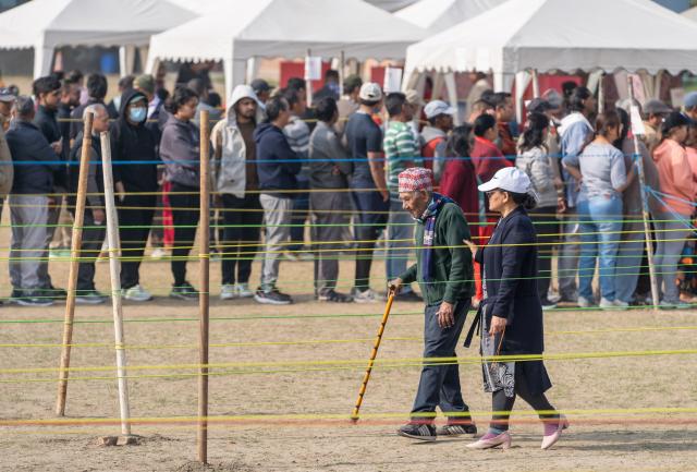 (260305) -- LALITPUR, March 5, 2026 (Xinhua) -- A senior participates in voting at a polling station during the parliamentary election in Lalitpur, Nepal, on March 5, 2026. Voting began across Nepal on Thursday morning to elect a new House of Representatives that was dissolved following violent protests in September last year. (Photo by Hari Maharjan/Xinhua)