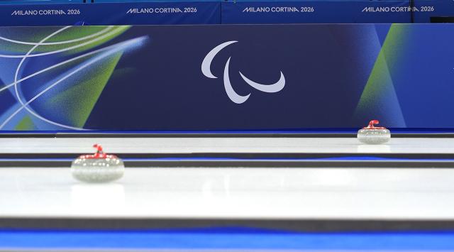 (260305) -- CORTINA D'AMPEZZO, March 5, 2026 (Xinhua) -- Curling stones are seen during the wheelchair curling mixed doubles round robin session 2 match between China and Latvia at the Milan-Cortina 2026 Paralympic Winter Games in Cortina D'ampezzo, Italy, March 5, 2026. (Xinhua/Hou Zhaokang)