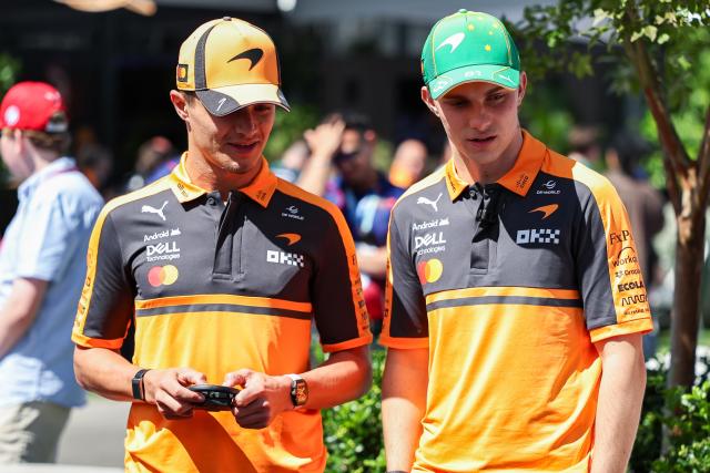 (260305) -- MELBOURNE, March 5, 2026 (Xinhua) -- McLaren's Lando Norris (L) of Britain and Oscar Piastri of Australia react during the Media Day of the Formula One Australia Grand Prix in Melbourne, Australia, March 5, 2026. (Photo by Qian Jun/Xinhua)