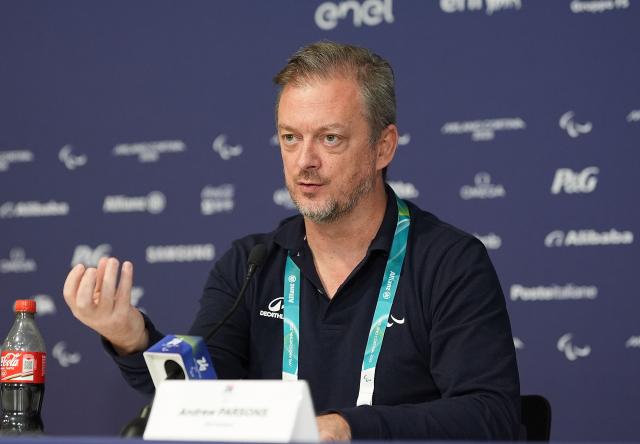 (260305) -- CORTINA D'AMPEZZO, March 5, 2026 (Xinhua) -- Andrew Parsons, president of International Paralympic Committee (IPC), speaks during an IPC media briefing at the Milan-Cortina 2026 Paralympic Winter Games in Cortina D'ampezzo, Italy, March 5, 2026. (Xinhua/Hou Zhaokang)