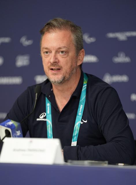 (260305) -- CORTINA D'AMPEZZO, March 5, 2026 (Xinhua) -- Andrew Parsons, president of International Paralympic Committee (IPC), speaks during an IPC media briefing at the Milan-Cortina 2026 Paralympic Winter Games in Cortina D'ampezzo, Italy, March 5, 2026. (Xinhua/Hou Zhaokang)
