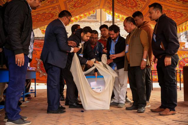(260305) -- KATHMANDU, March 5, 2026 (Xinhua) -- Staff members pack a ballot box in a polling station after the voting for  the House of Representatives elections concluded in Kathmandu, Nepal, on March 5, 2026. Around 60 percent of eligible voters cast their votes in the House of Representatives elections in Nepal that concluded on Thursday, the top official of the Election Committee said. (Photo by Sulav Shrestha/Xinhua)