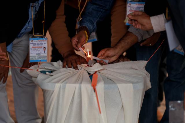 (260305) -- KATHMANDU, March 5, 2026 (Xinhua) -- Staff members seal a ballot box in a polling station after the voting for the House of Representatives elections concluded in Kathmandu, Nepal, on March 5, 2026. Around 60 percent of eligible voters cast their votes in the House of Representatives elections in Nepal that concluded on Thursday, the top official of the Election Committee said. (Photo by Sulav Shrestha/Xinhua)