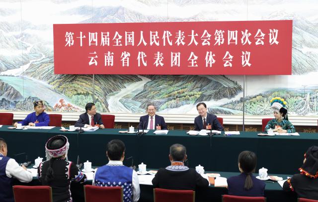 (260305) -- BEIJING, March 5, 2026 (Xinhua) -- Li Qiang, a member of the Standing Committee of the Political Bureau of the Communist Party of China Central Committee and Chinese premier, joins his fellow deputies from the delegation of Yunnan Province to deliberate on the government work report at the fourth session of the 14th National People's Congress in Beijing, capital of China, March 5, 2026. (Xinhua/Huang Jingwen)
