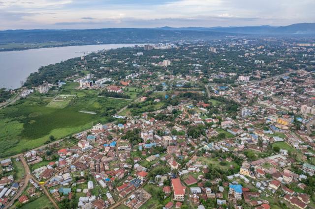 (260305) -- KISUMU, March 5, 2026 (Xinhua) -- An aerial drone photo taken on Feb. 27, 2026 shows a view of Kisumu, a key economic and transport hub in western Kenya. Located in Kisumu County, a key economic and transport hub in western Kenya, the area is well known for sugarcane cultivation and sugar production. A road project undertaken by Power Construction Corporation of China (PowerChina) is now bringing visible change to the region. (Xinhua/Xie Jianfei)