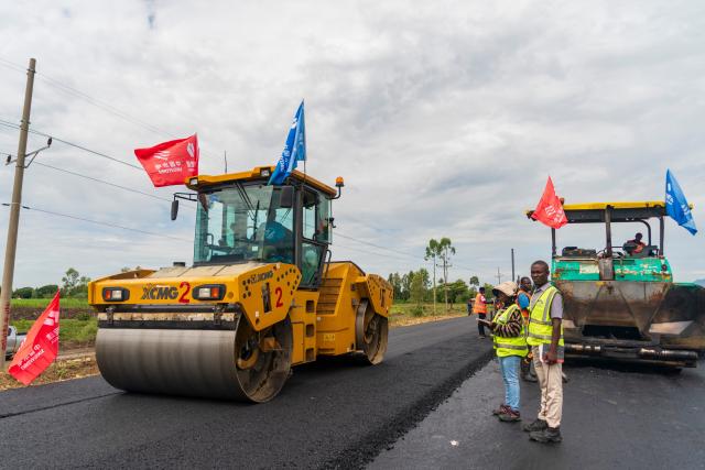 (260305) -- KISUMU, March 5, 2026 (Xinhua) -- Construction vehicles and workers of Power Construction Corporation of China operate at the construction site of the second section of the Kisumu-Muhoroni highway project in a major sugarcane-producing area of Kisumu County, Kenya, on Feb. 27, 2026. Located in Kisumu County, a key economic and transport hub in western Kenya, the area is well known for sugarcane cultivation and sugar production. A road project undertaken by Power Construction Corporation of China (PowerChina) is now bringing visible change to the region. (Xinhua/Xie Jianfei)