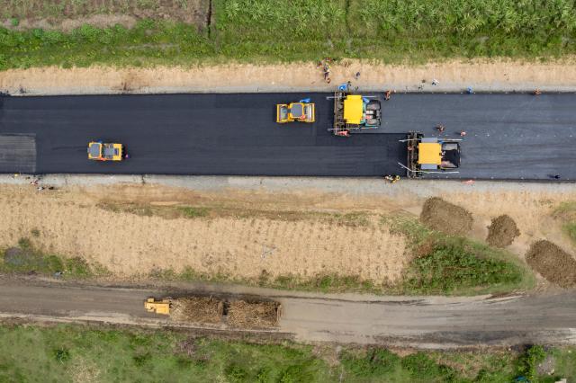 (260305) -- KISUMU, March 5, 2026 (Xinhua) -- An aerial drone photo taken on Feb. 27, 2026 shows the construction site of the second section of the Kisumu-Muhoroni highway project built by Power Construction Corporation of China in a major sugarcane-producing area of Kisumu County, Kenya. Located in Kisumu County, a key economic and transport hub in western Kenya, the area is well known for sugarcane cultivation and sugar production. A road project undertaken by Power Construction Corporation of China (PowerChina) is now bringing visible change to the region. (Xinhua/Xie Jianfei)