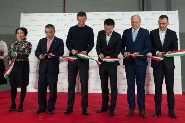 (260306) -- KAPUVAR, March 6, 2026 (Xinhua) -- Hungarian Minister of Foreign Affairs and Trade Peter Szijjarto (3rd L) cuts the ribbon during the inauguration ceremony of the second phase of Chinese technology company Intretech's manufacturing facility in Kapuvar, Hungary, March 5, 2026. TO GO WITH "Chinese investments crucial to Hungary's economy: Hungarian FM " (Photo by Attila Volgyi/Xinhua)