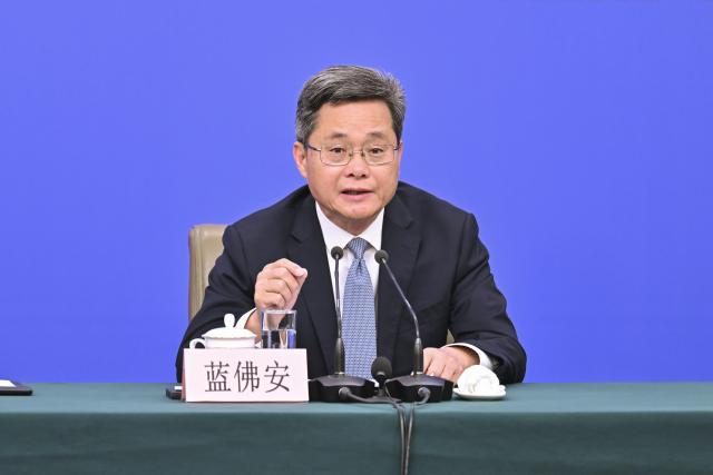 (260306) -- BEIJING, March 6, 2026 (Xinhua) -- Chinese Finance Minister Lan Fo'an attends a press conference for the fourth session of the 14th National People's Congress (NPC) on economy in Beijing, capital of China, March 6, 2026. (Xinhua/Li Xin)
