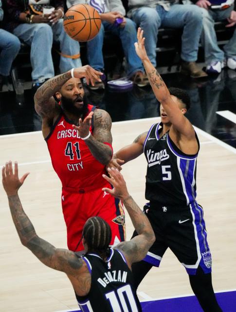 (260306) -- SACRAMENTO, March 6, 2026 (Xinhua) -- Saddiq Bey (top L) of New Orleans Pelicans passes the ball during the 2025-2026 NBA regular season basketball game between New Orleans Pelicans and Sacramento Kings in Sacramento, the United States, March 5, 2026. (Photo by Sun Yuxuan/Xinhua)