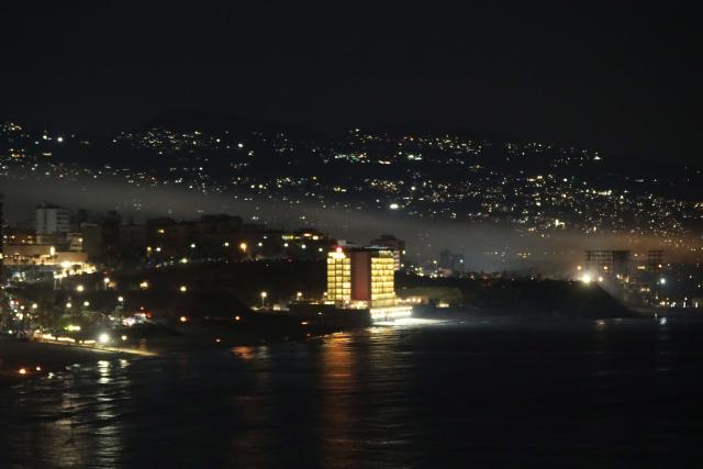 (260306) -- BEIRUT, March 6, 2026 (Xinhua) -- This photo taken on March 5, 2026 shows smoke lingering over the southern suburbs of Beirut, Lebanon, following Israeli airstrikes. Israeli warplanes launched a new wave of airstrikes on Beirut's southern suburbs late Thursday, hours after Israel warned all residents to evacuate the entire Dahieh area, local broadcaster al-Jadeed reported. (Xinhua/Bilal Jawich)