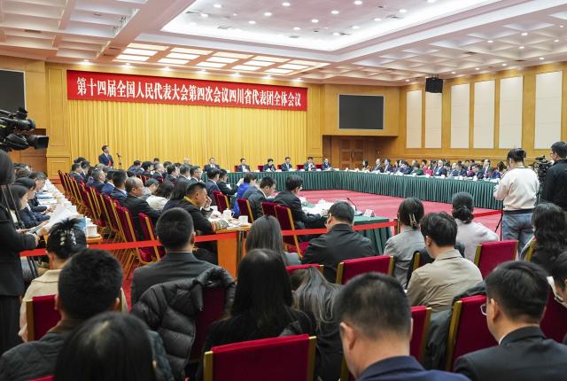 (260306) -- BEIJING, March 6, 2026 (Xinhua) -- A group meeting of deputies from the delegation of Sichuan Province is held at the fourth session of the 14th National People's Congress (NPC) in Beijing, capital of China, March 6, 2026. (Xinhua/Wang Xi)