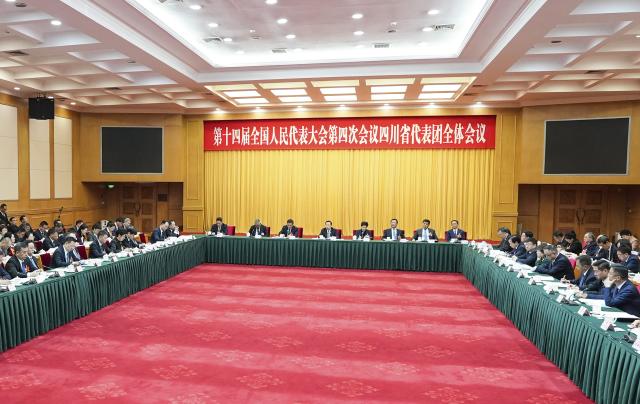 (260306) -- BEIJING, March 6, 2026 (Xinhua) -- A group meeting of deputies from the delegation of Sichuan Province is held at the fourth session of the 14th National People's Congress (NPC) in Beijing, capital of China, March 6, 2026. (Xinhua/Wang Xi)