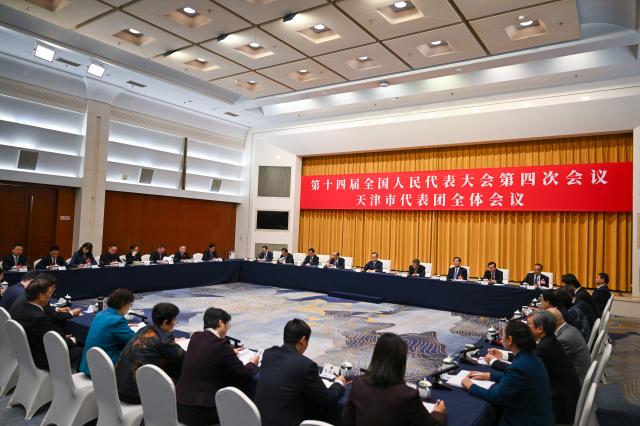 (260306) -- BEIJING, March 6, 2026 (Xinhua) -- A group meeting of deputies from the delegation of Tianjin is held at the fourth session of the 14th National People's Congress (NPC) in Beijing, capital of China, March 6, 2026. (Xinhua/Cai Xiangxin)