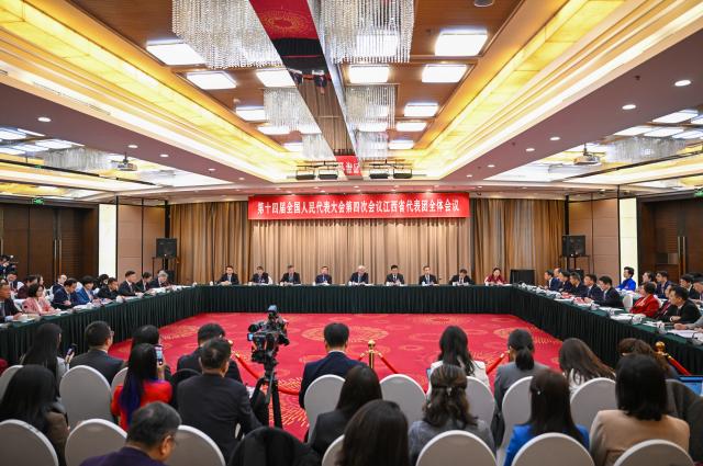 (260306) -- BEIJING, March 6, 2026 (Xinhua) -- A group meeting of deputies from the delegation of Jiangxi Province is held at the fourth session of the 14th National People's Congress (NPC) in Beijing, capital of China, March 6, 2026. (Xinhua/Cai Xiangxin)