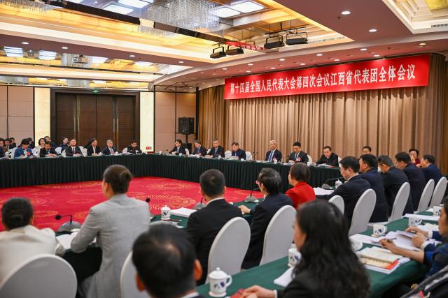 (260306) -- BEIJING, March 6, 2026 (Xinhua) -- A group meeting of deputies from the delegation of Jiangxi Province is held at the fourth session of the 14th National People's Congress (NPC) in Beijing, capital of China, March 6, 2026. (Xinhua/Cai Xiangxin)