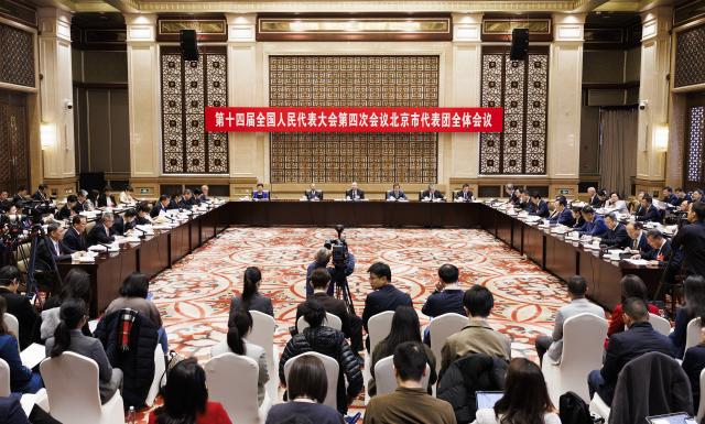 (260306) -- BEIJING, March 6, 2026 (Xinhua) -- A group meeting of deputies from the delegation of Beijing is held at the fourth session of the 14th National People's Congress (NPC) in Beijing, capital of China, March 6, 2026. (Xinhua/Jin Liwang)