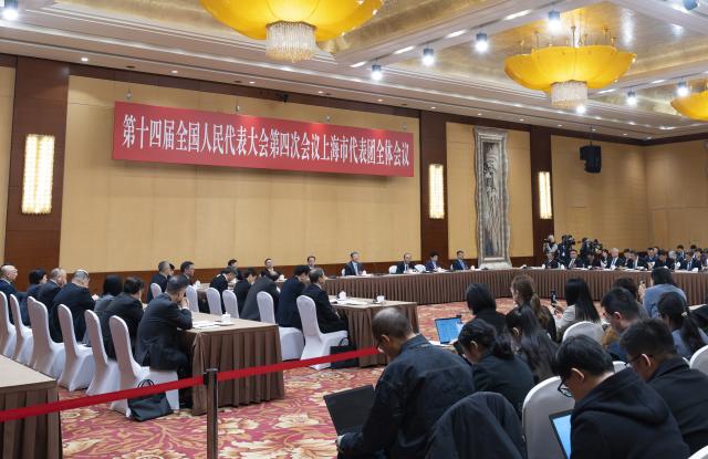 (260306) -- BEIJING, March 6, 2026 (Xinhua) -- A group meeting of deputies from the delegation of Shanghai is held at the fourth session of the 14th National People's Congress (NPC) in Beijing, capital of China, March 6, 2026. (Xinhua/Li Minggang)