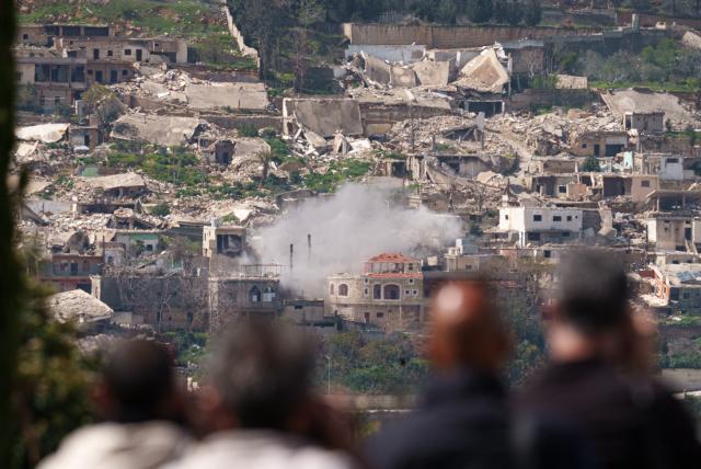 (260306) -- KIRYAT SHMONA, March 6, 2026 (Xinhua) -- Smoke rises from an explosion following Israeli bombardment on a southern Lebanese village, as seen from the Israeli side of the border with Lebanon, March 6, 2026. Hezbollah on Monday fired missiles and drones toward Israel, saying the attacks were in retaliation for the killing of Iran's Supreme Leader Ali Khamenei in a joint U.S.-Israeli strike and for repeated Israeli attacks on Lebanon. Israel responded with massive airstrikes on Hezbollah targets and deployed ground forces into southern Lebanon, marking a sharp escalation in the conflict. (JINI via Xinhua)