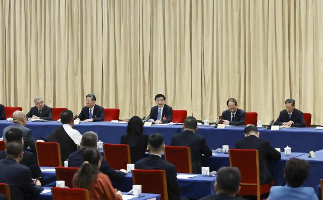 (260306) -- BEIJING, March 6, 2026 (Xinhua) -- Wang Huning, a member of the Standing Committee of the Political Bureau of the Communist Party of China (CPC) Central Committee and chairman of the Chinese People's Political Consultative Conference (CPPCC) National Committee, participates in a joint group meeting of political advisors from the sectors of literature, the arts and sports at the fourth session of the 14th National Committee of the CPPCC in Beijing, capital of China, March 6, 2026. (Xinhua/Wang Ye)