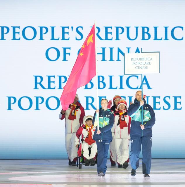 (260307) -- VERONA, March 7, 2026 (Xinhua) -- Members of the delegation of China parade during the opening ceremony of Milan-Cortina 2026 Paralympic Winter Games at Verona Olympic Arena in Verona, Italy, March 6, 2026. (Xinhua/Li Jing)